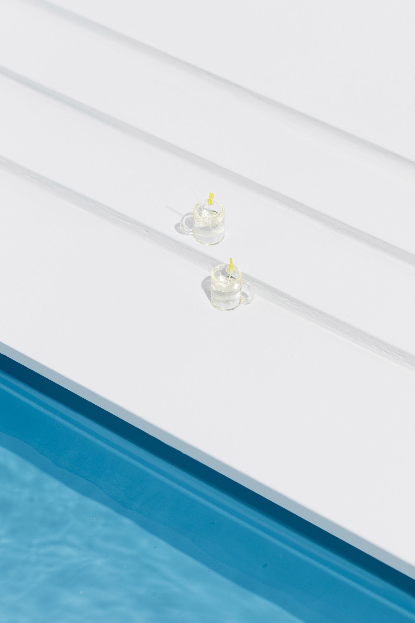 A miniature pool still-life arrangement, used to illustrate finished pool styling